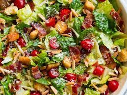 The American Salad-Romaine Topped with Bacon,Shredded Cheese, Tomatoes and Onions…