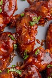 Baked Chicken Wings -1 Lb House Baked Wing Tossed in Your Choice of: BBQ, Asian Zing or Bu…